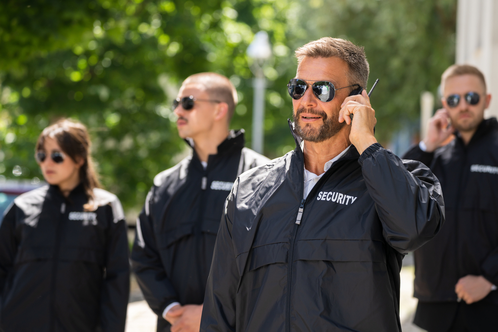 Security guard making an emergency phone call.