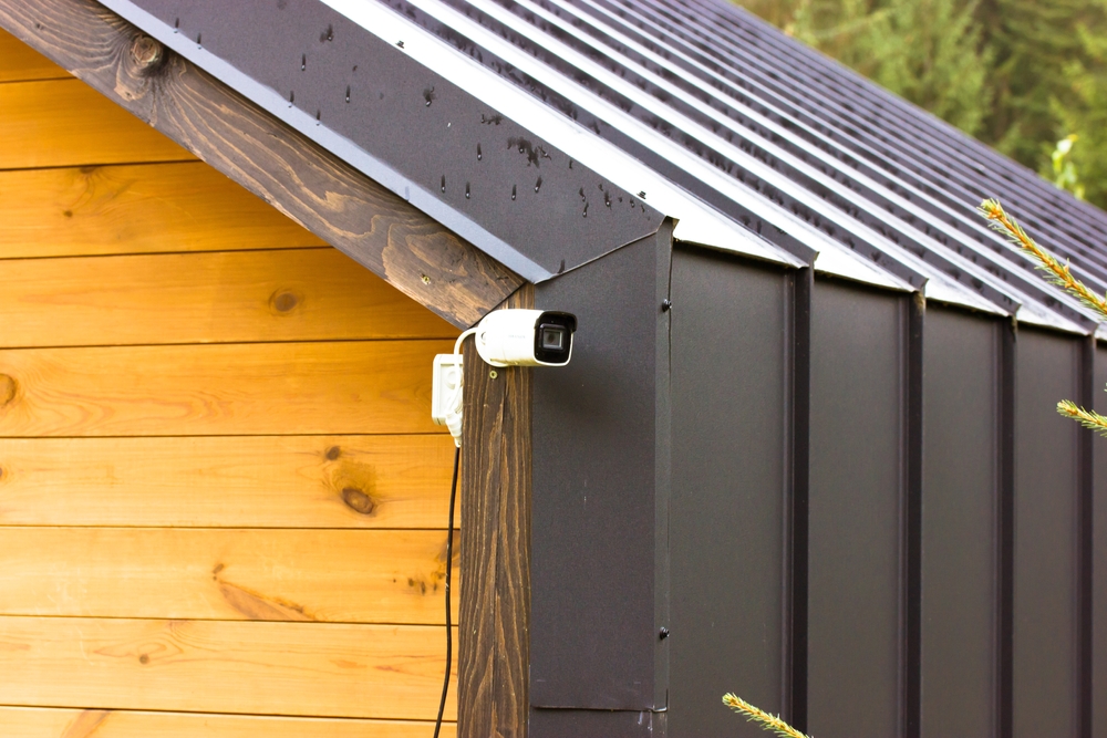 Cctv rotating home surveillance system hanging on a corner