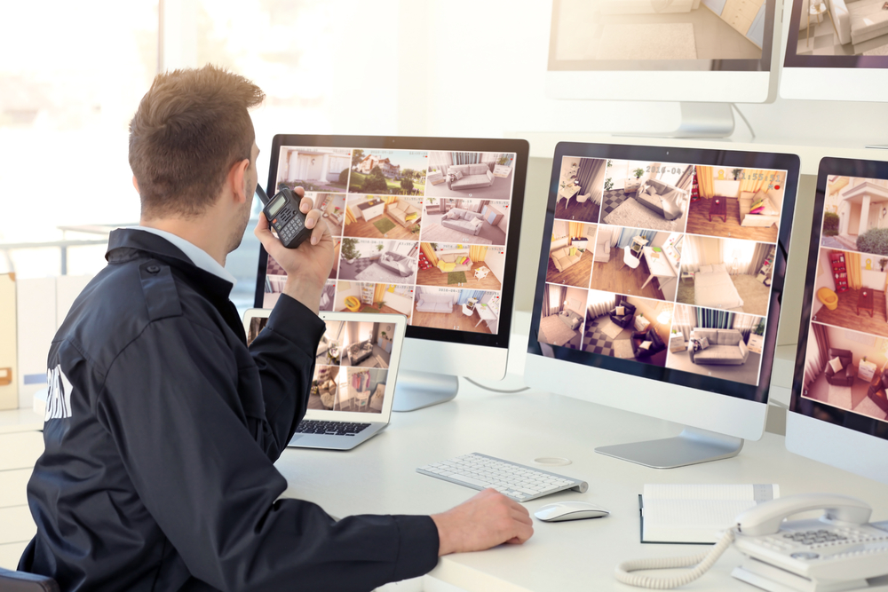 Security guard monitoring safety of a gated community