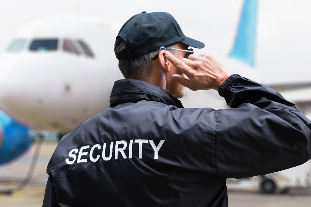 Rear view of a security officer wearing black jacket